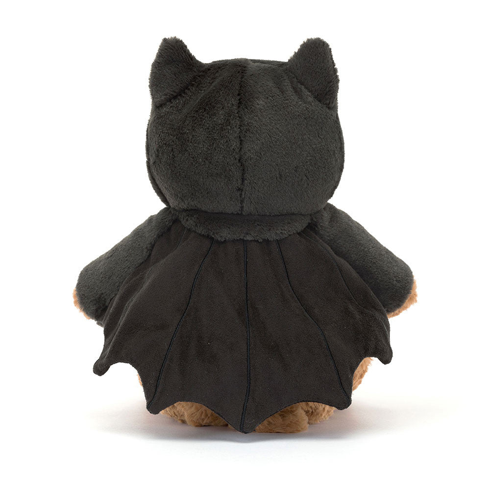 Bartholomew Bear Bat - TAYLOR + MAXJellycat - A teddy bear wearing a bat costume, with its back facing the camera