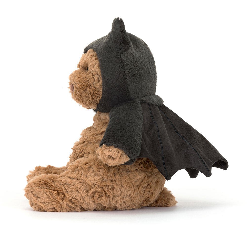 Bartholomew Bear Bat - TAYLOR + MAXJellycat - A teddy bear wearing a bat costume, turned to the side