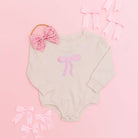 Coquette Bow Patch Long Sleeve Romper - Natural: 00 - 3M - TAYLOR + MAXSweet Wink