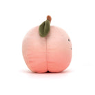 Fabulous Fruit Peach - TAYLOR + MAXJellycat - A smiling stuffed peach turned to the side